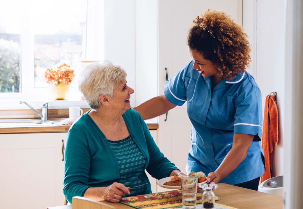 professional caregiver taking care of seniors in Boston