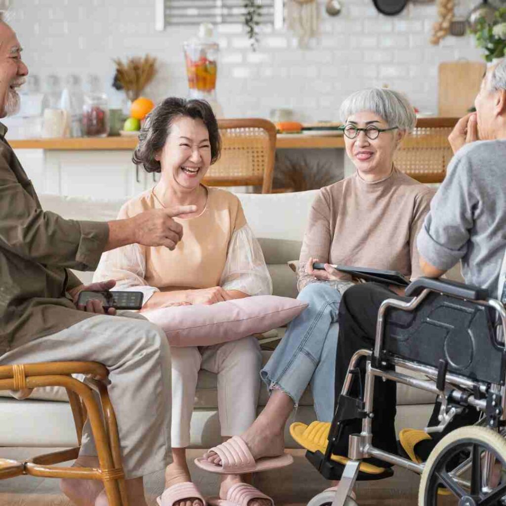 Four seniors both men and women chatting as an indoor activity for seniors