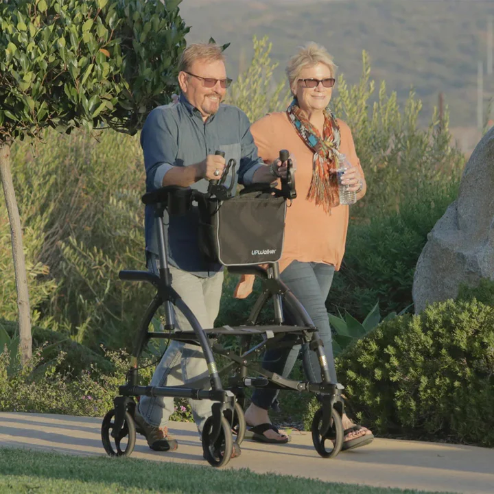 An “upright” forearm-support walker (UPWalker) in use, allowing the senior to stand straight and distribute weight through the forearms.